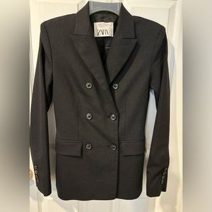 Black double breasted blazer with 6 buttons. Fully lined.